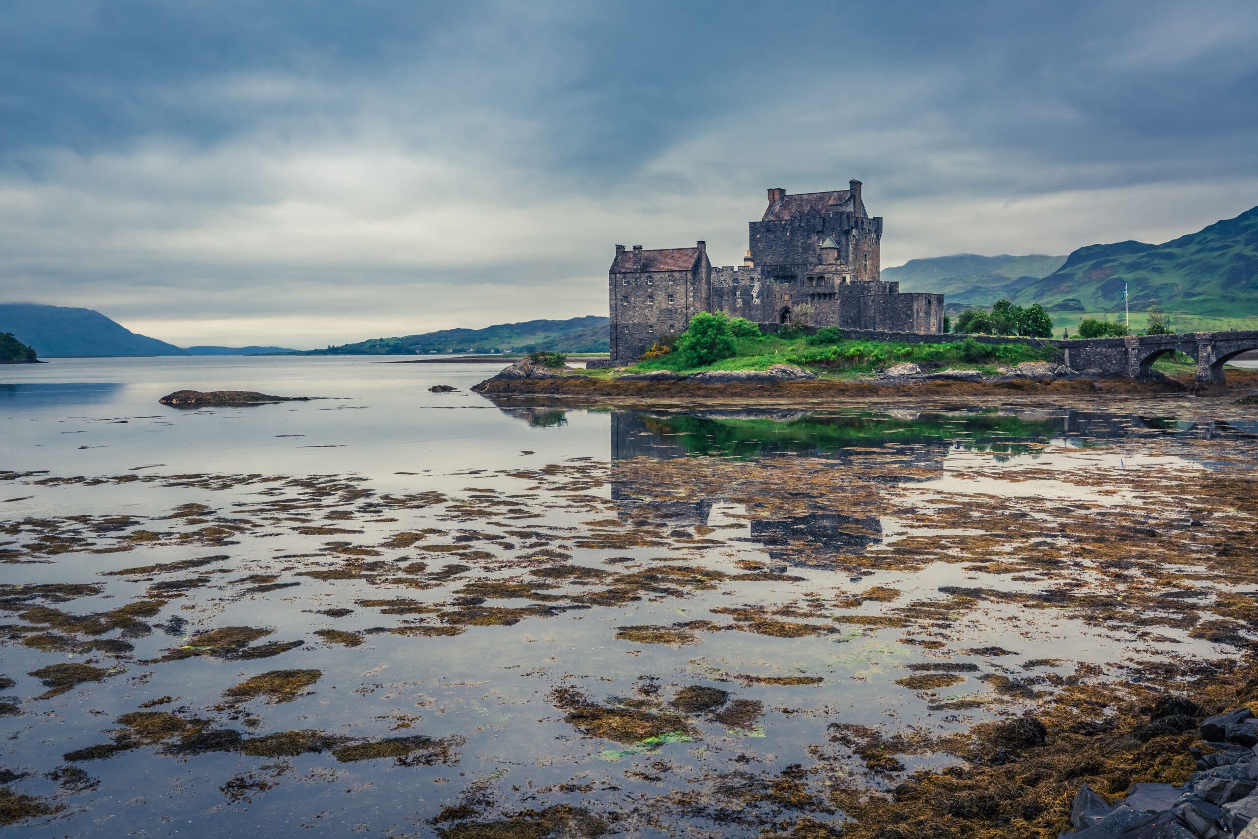 Sunset over lake at Eilean Donan Castle, Scotland, UK