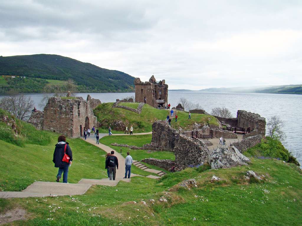 Urquhart Castle and Loch Ness surrounded by autumn colours